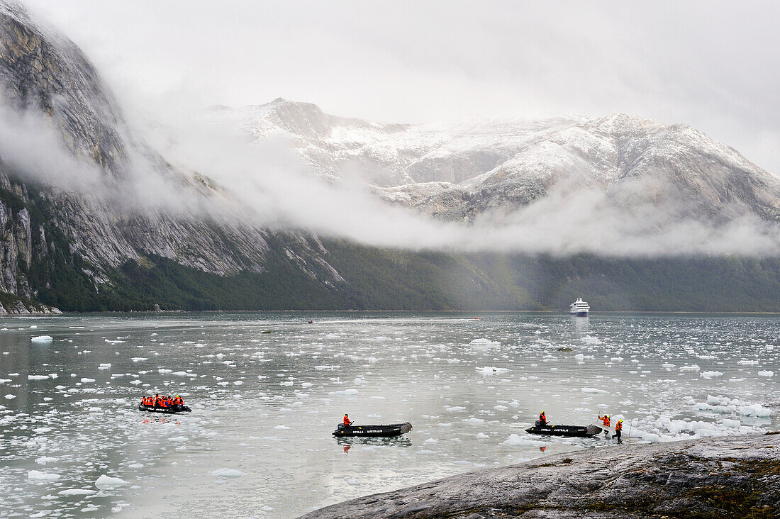 passengers from Stella Australis cruise-ship landing to watch Pia Glacier,Cordillera Darwin,Beagle Channel (Northeast branch),Tierra del Fuego, Patagonia,Chile,South America