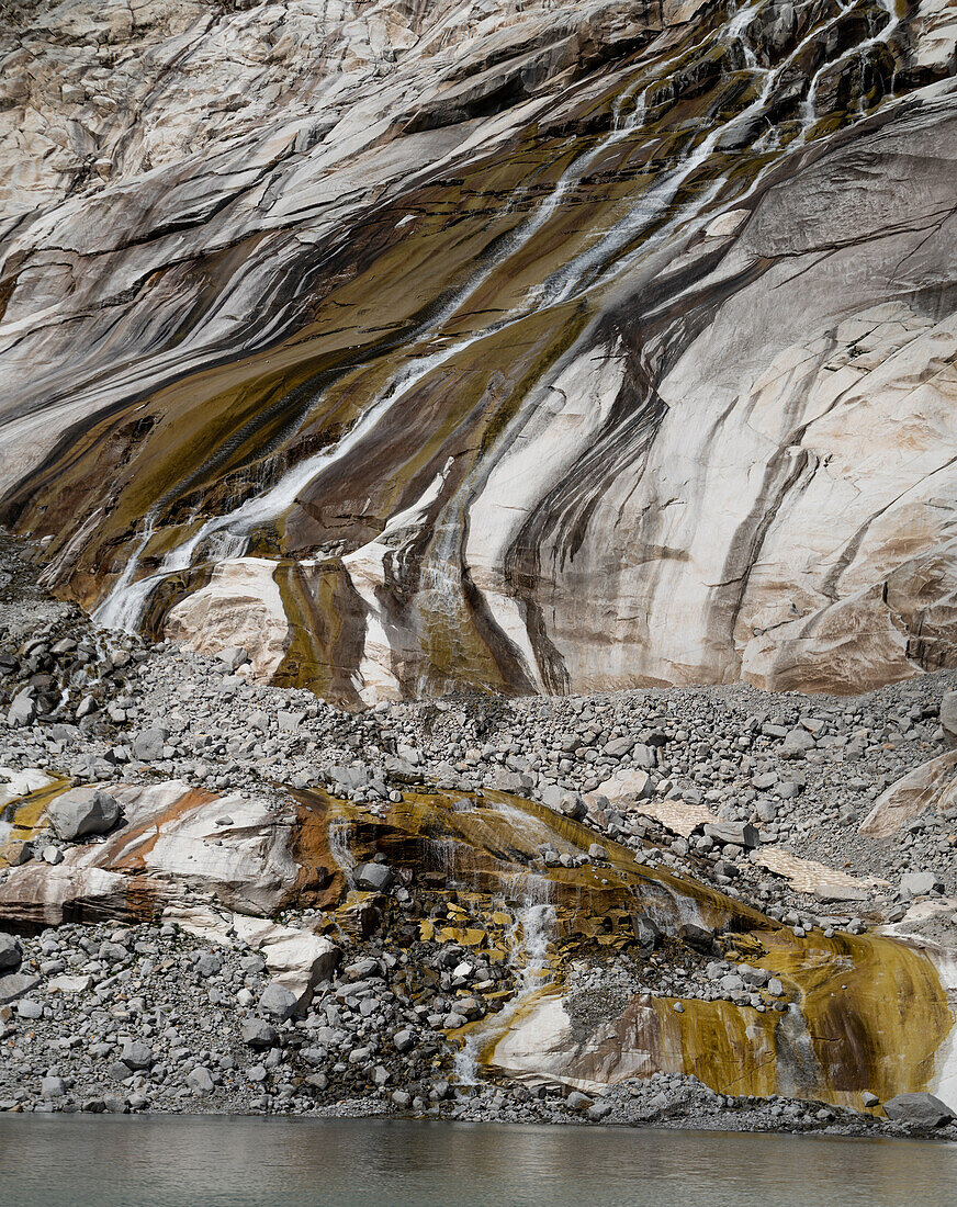  Glacier water flows over rocks polished by the glacier, Stubach Glacier, Hohe Tauern National Park, Salzburg, Austria 