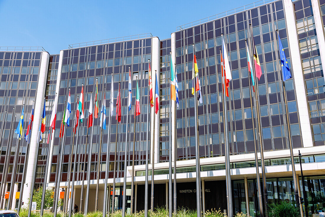  Winston Churchill Building of the Parlament Européen (European Parliament) with flags of the EU in the Quartier Européen (European Quarter) in Strasbourg in the Bas-Rhin department in the Grand Est region in Alsace in France 