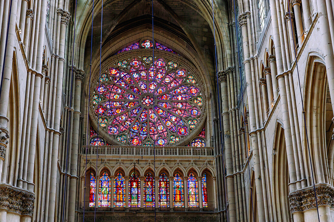  Interior of the cathedral with rosette and stained glass windows depicting kings in Reims in the Champagne wine-growing region in the Marne department in the Grande Est region of France 