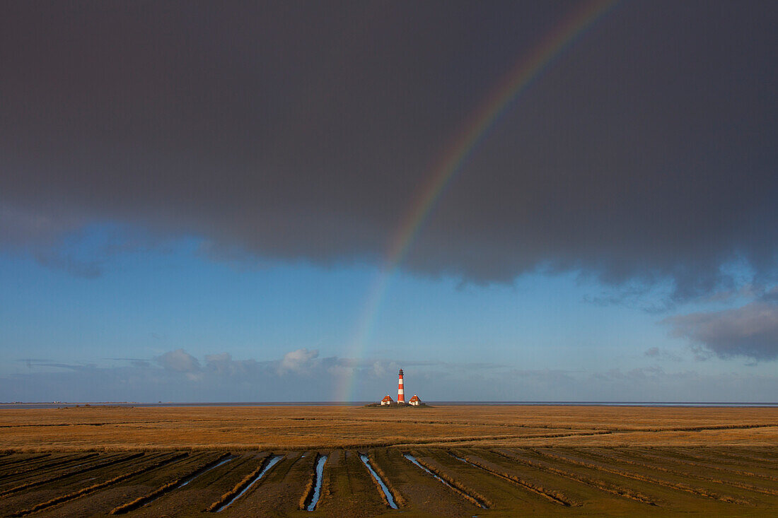  Westerhever lighthouse with a rainbow, Wadden Sea National Park, North Friesland, Schleswig-Holstein, Germany 