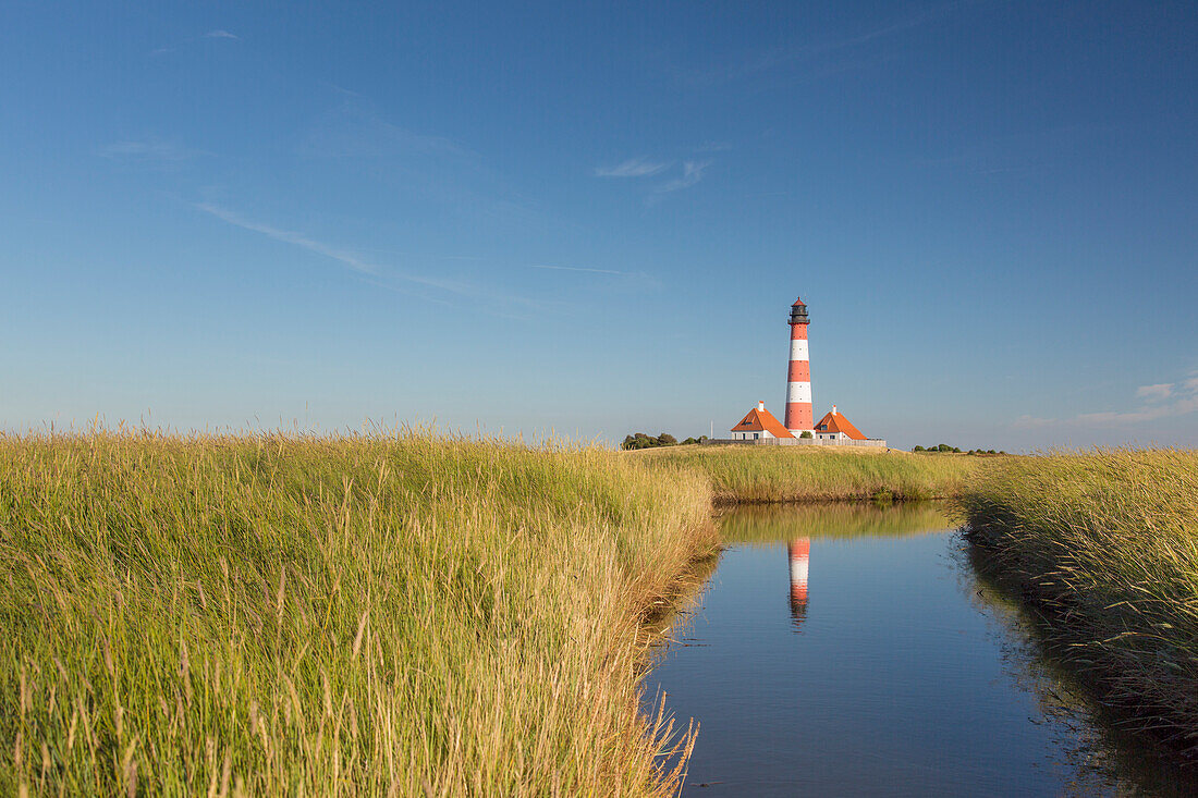  Westerhever lighthouse with reflection, Wadden Sea National Park, North Friesland, Schleswig-Holstein, Germany 