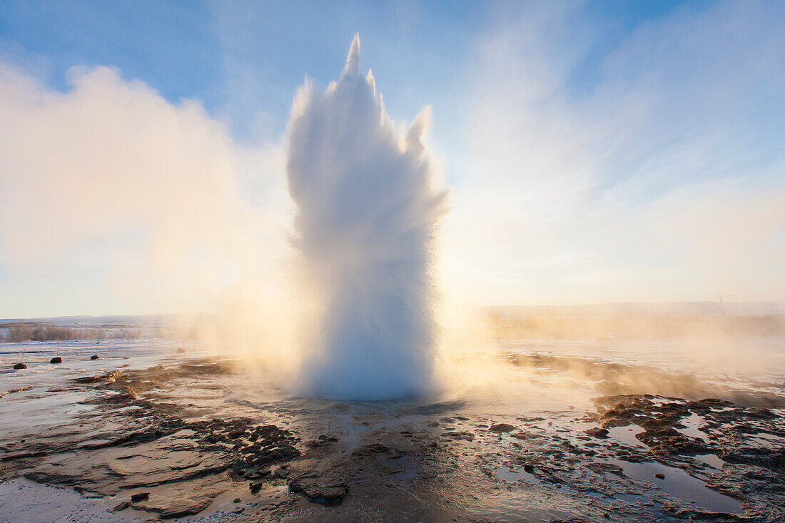  Strokkur Geysir (Butter Churn Geysir) in the Haukadalur hot spring valley erupting, winter, Iceland 