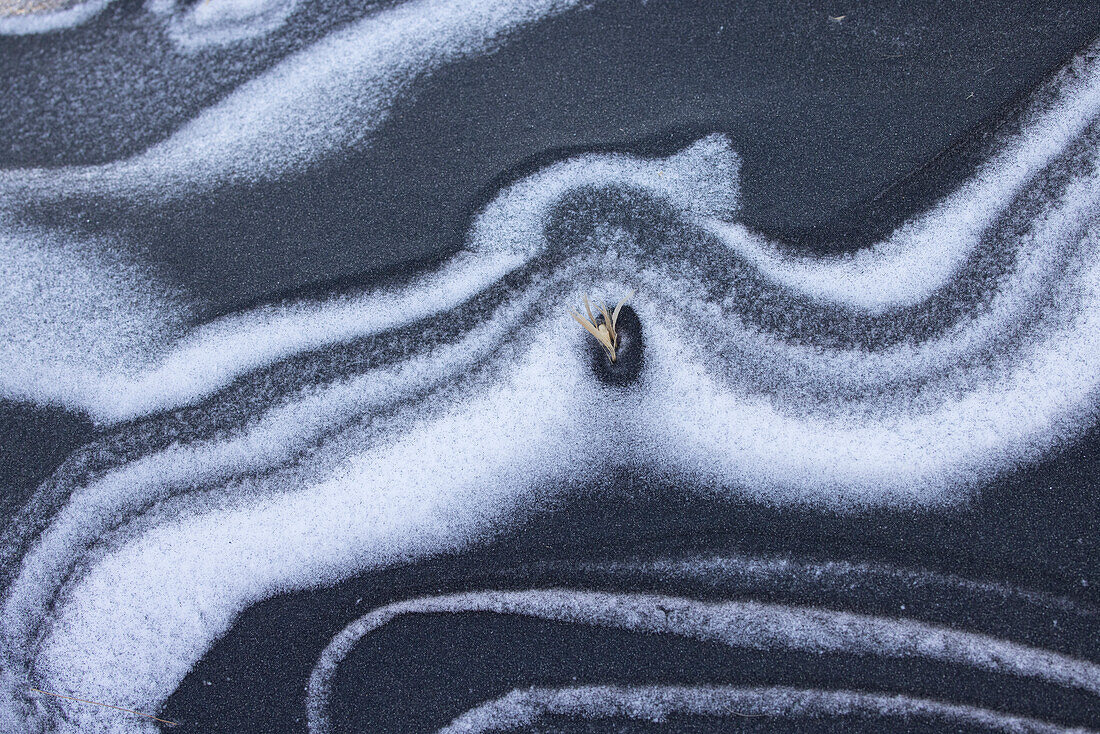  Snow structures in black lava sand, winter, Stokksnes, Iceland 