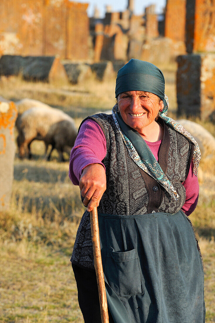 shepherdess at Noratus cemetery (the largest surviving cemetery with khachkars in Armenia), near Lake Sevan, Gegharkunik region, Armenia, Eurasia