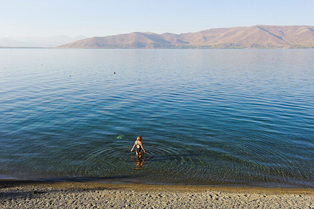 swimming into Lake Sevan at the beach of the Blue Sevan Hotel, Chambarak, Gegharkunik region, Armenia, Eurasia