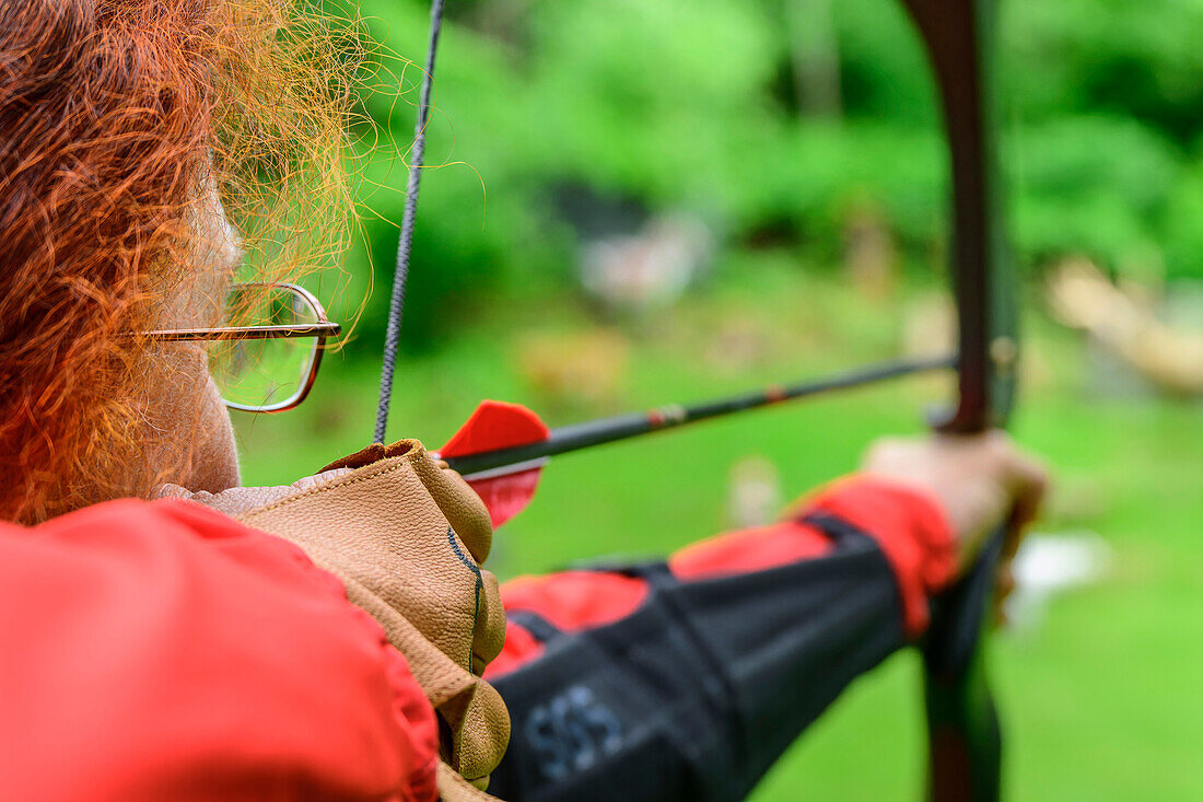  Woman archery, Millstätter See, Nockberge, Niedere Tauern, Carinthia, Austria 