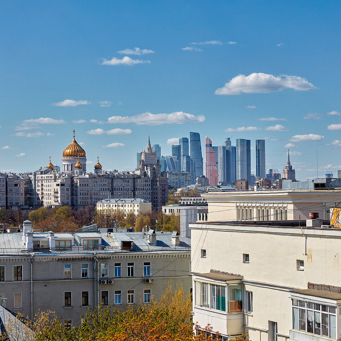 Aerial view of historical Zamoskvorechye District with skyscrapers of the Moscow City in the background. Moscow, Russian Federation.