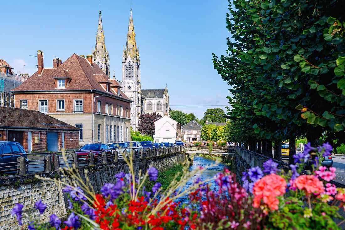  Bridge over the river Vie and view of the neo-Gothic church Notre-Dame in Vimoutiers in the Pays d&#39;Auge in the Calvados department in the Normandy region of France 