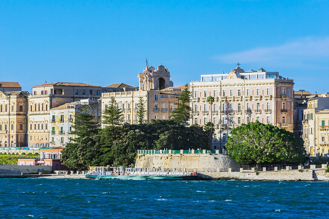  Green waterfront promenade with interesting buildings in Syracuse, Sicily, Italy  