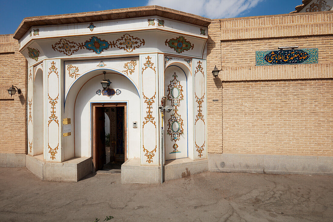 Ornate entrance gate of the Mollabashi Historical House in Isfahan, Iran.