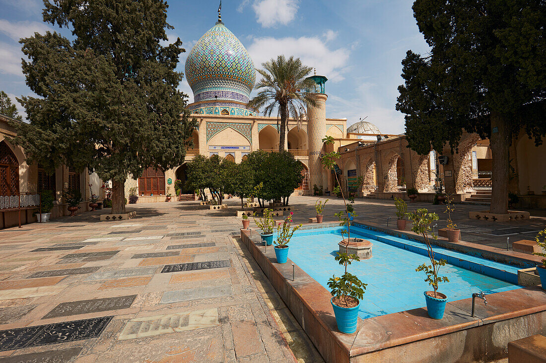 Courtyard of Ali Ibn Hamzeh Holy Shrine with a water pool. Shiraz, Iran.