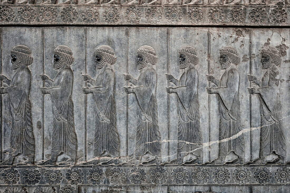 Bas-relief on the Grand Staircase of Apadana Palace depicts members of the Ten Thousand Immortals, special army of ancient Persia. Persepolis, Iran.