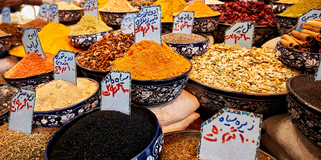 Colorful selection of local spices for sale displayed at the Vakil Bazaar in Shiraz, Iran.