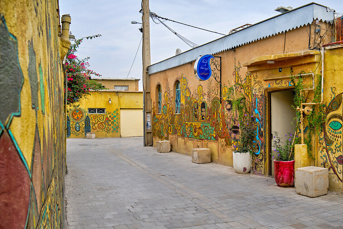 Colorful murals on old houses in the historical center of Shiraz, Iran.