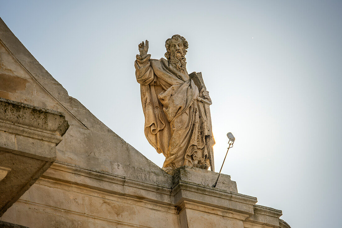 One of the statues on the roof of the Mother Church of San Giorgio Martire in Locorotondo, Puglia, Italy.