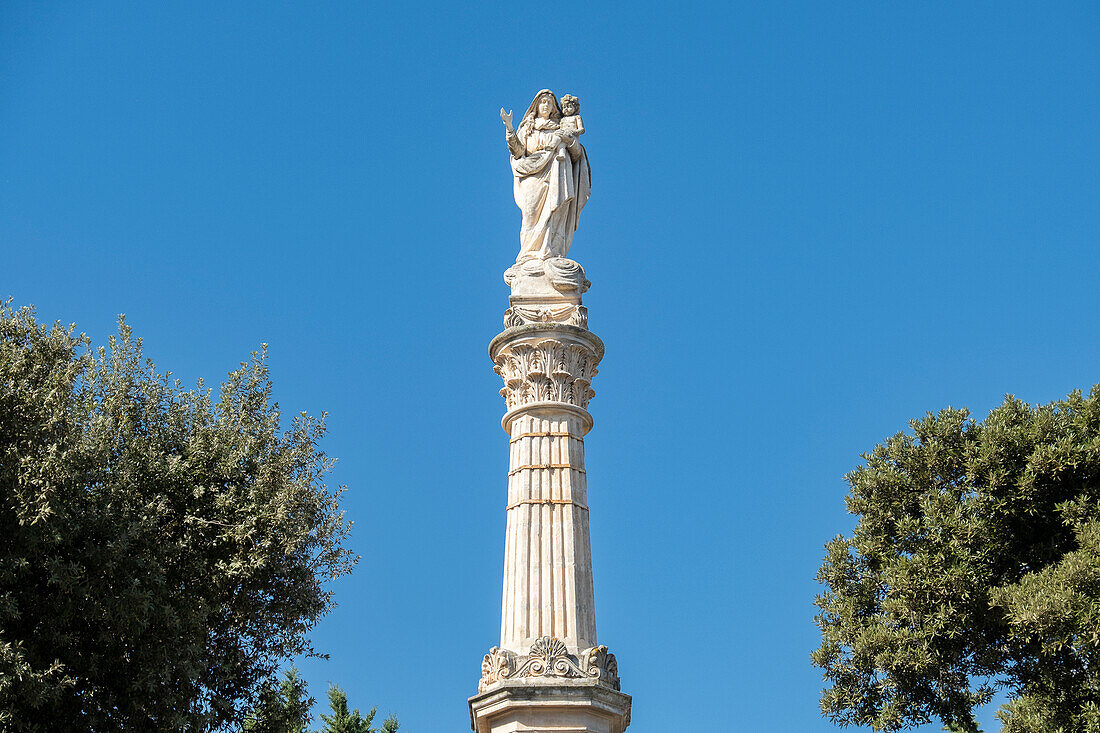 The votive column with statue of the Blessed Virgin of Mount Carmel atop in Mesagne, Puglia, Italy.