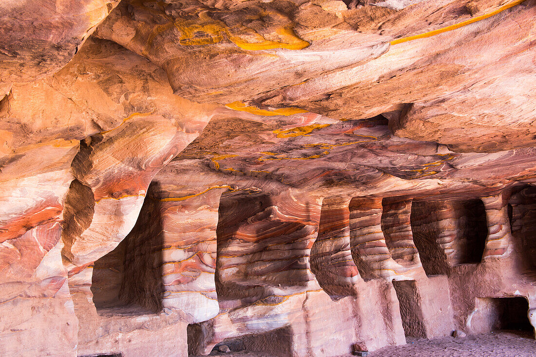 Multicolored sandstone, due to the various oxides, in which were dug and carved caves and tombsHistoric and archaeological Nabataean city of Petra, UNESCO World Heritage Site, Jordan, Near East, Southern Levant, West Asia