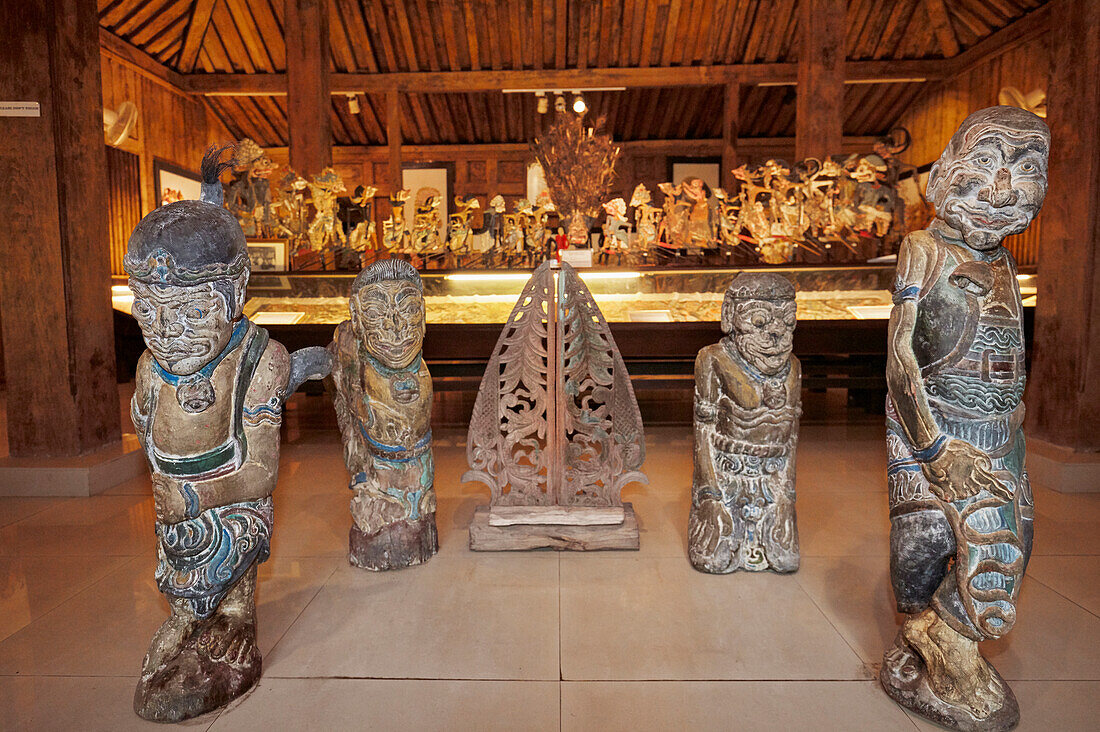 Wooden figures displayed in the Setia Darma House of Masks and Puppets. Mas, Ubud, Bali, Indonesia.