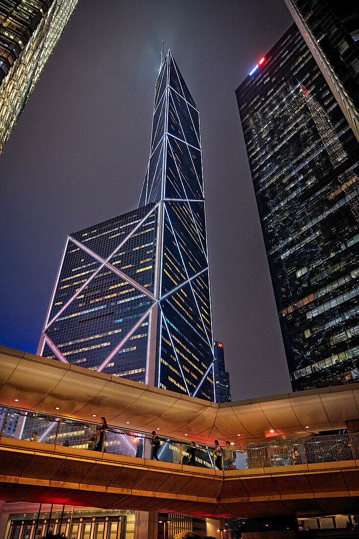 Exterior view of skyscrapers in Central District illuminated at night. Hong Kong, China.