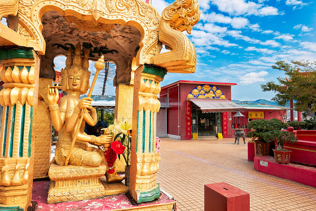 Gilded statue with many faces and hands at the Ten Thousand Buddhas Monastery (Man Fat Sze). Sha Tin, New Territories, Hong Kong, China.