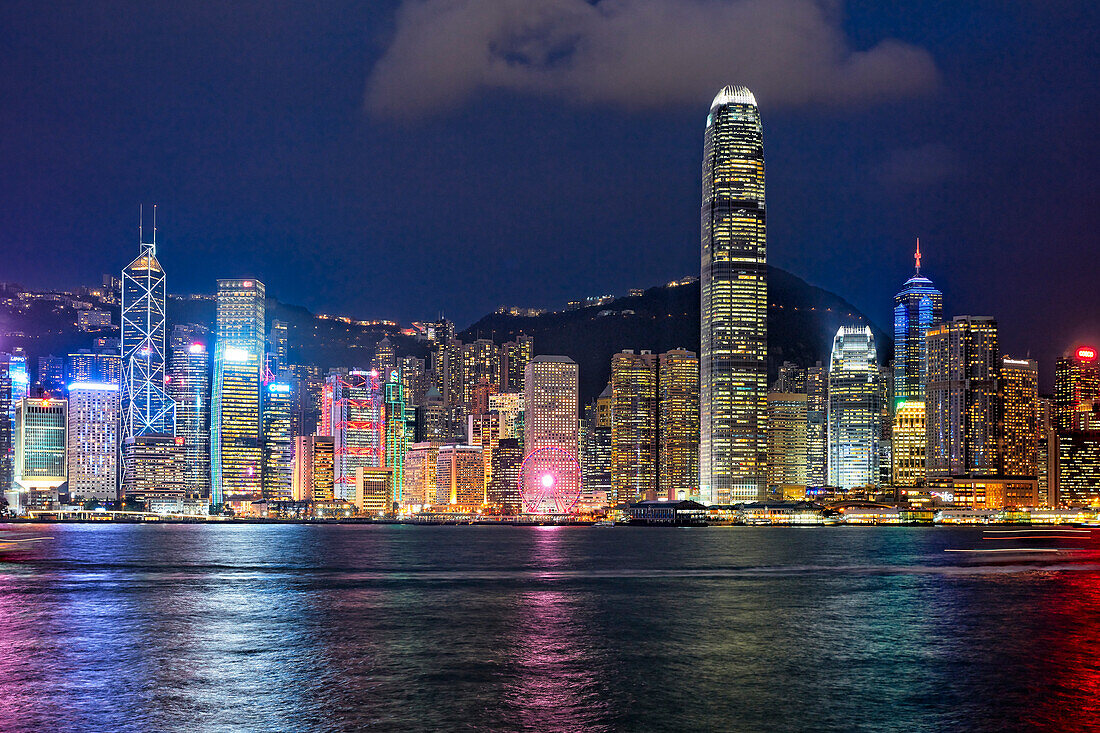 Iconic view of the Central Waterfront skyscrapers illuminated at night. Hong Kong, China.