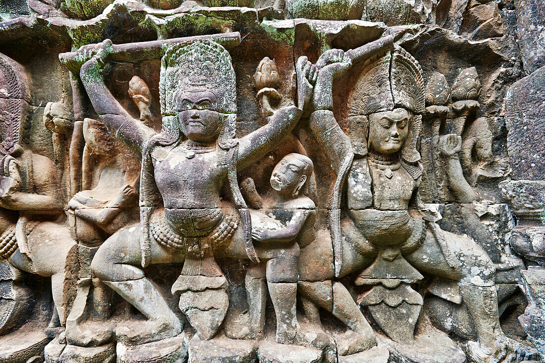 Intricate stone carvings on Terrace of the Elephants in Angkor Thom temple complex. Angkor Archaeological Park, Siem Reap Province, Cambodia.