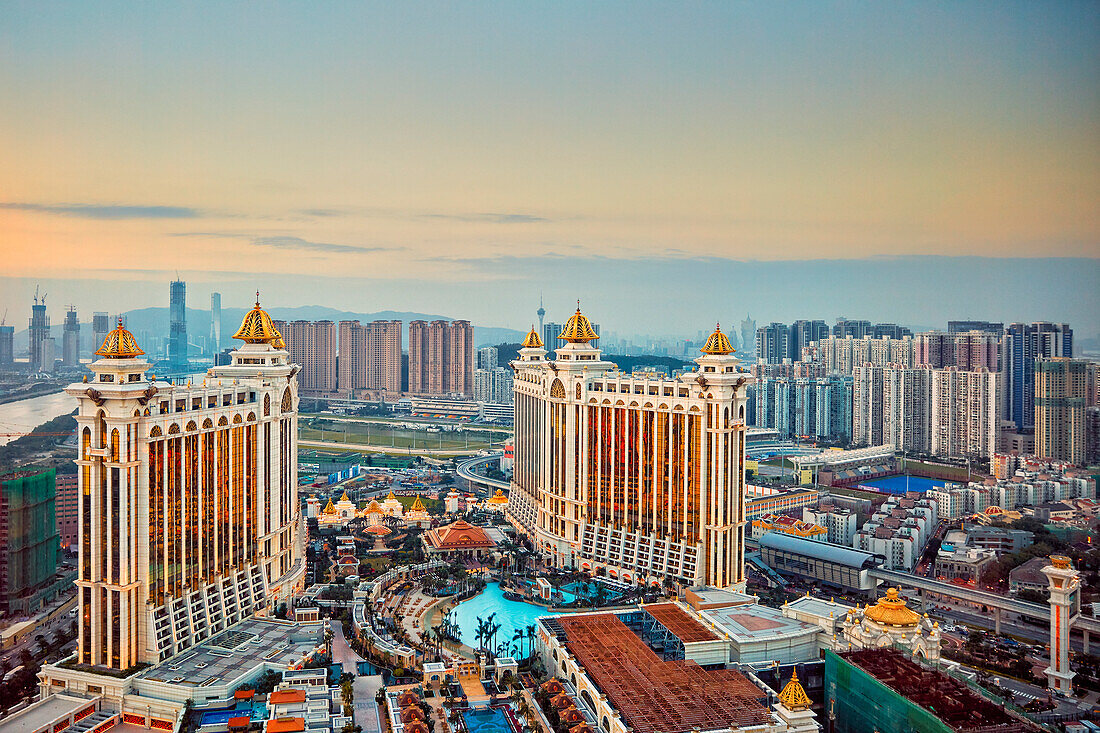 Aerial view of the Galaxy Macau Hotel, a luxurious resort complex, at dusk. Cotai, Macau, China.