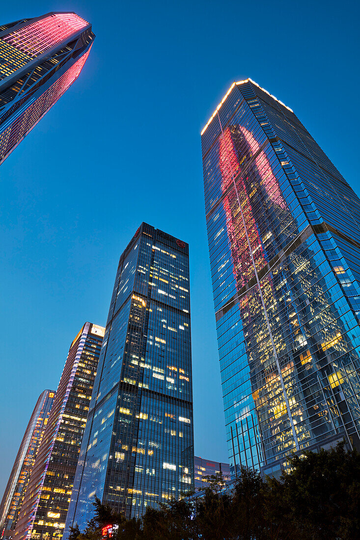 High-rise buildings in Futian Central Business District (CBD) illuminated at dusk. Shenzhen, Guangdong Province, China.