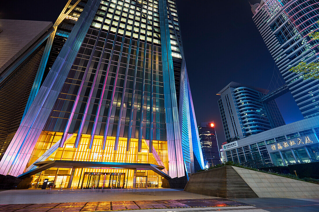 Base part of Ping An International Finance Centre, a 599 meters high skyscraper in Futian CBD, illuminated at night. Shenzhen, Guangdong, China.