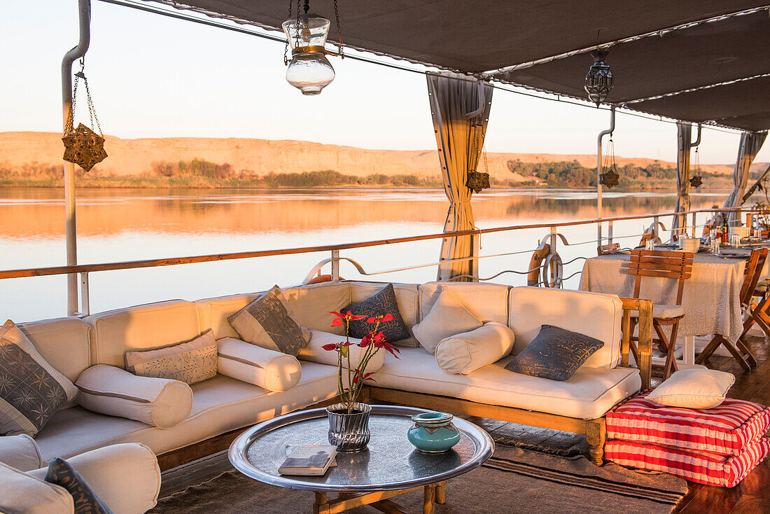 Lounge on the deck of a Dahabeah,passenger river boat of the Lazuli fleet, sailing on the Nile river, Egypt, northeast Africa