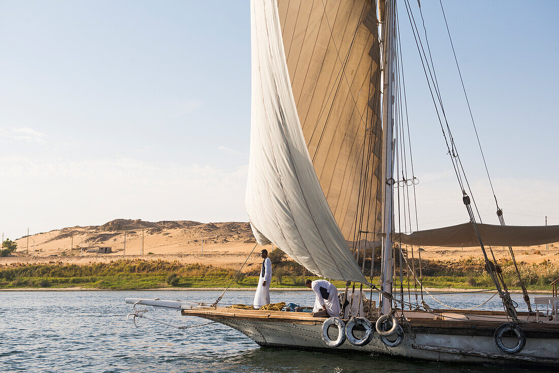 Dahabeah under sail, passenger river boat of the Lazuli fleet, sailing on the Nile river near Aswan, Egypt, northeast Africa