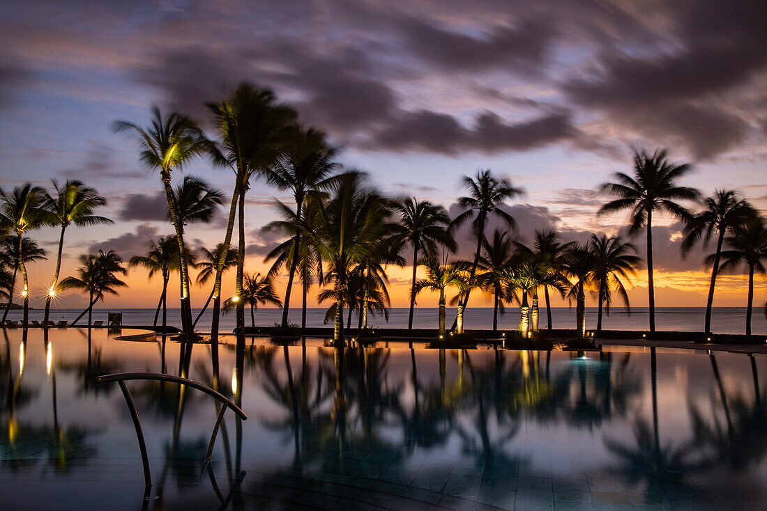  Reflection of coconut trees in the swimming pool of the Trou aux Biches Beachcomber Golf Resort 