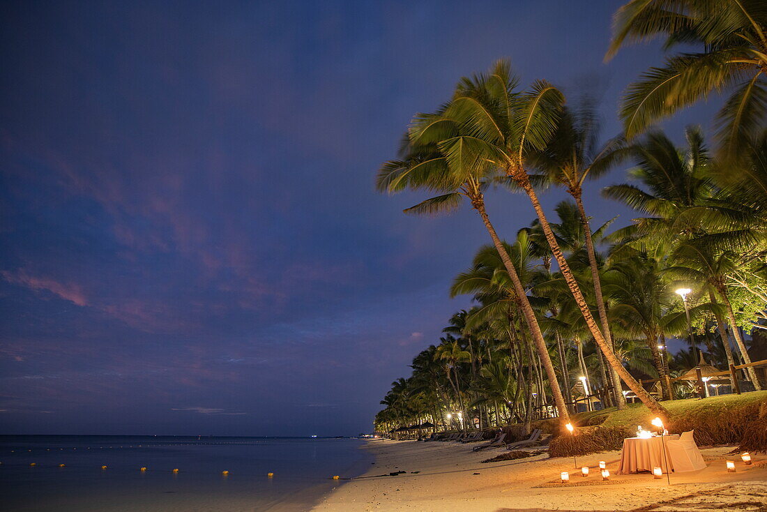  Table and chairs for a romantic candlelight dinner on the beach of the Trou aux Biches Beachcomber Golf Resort 