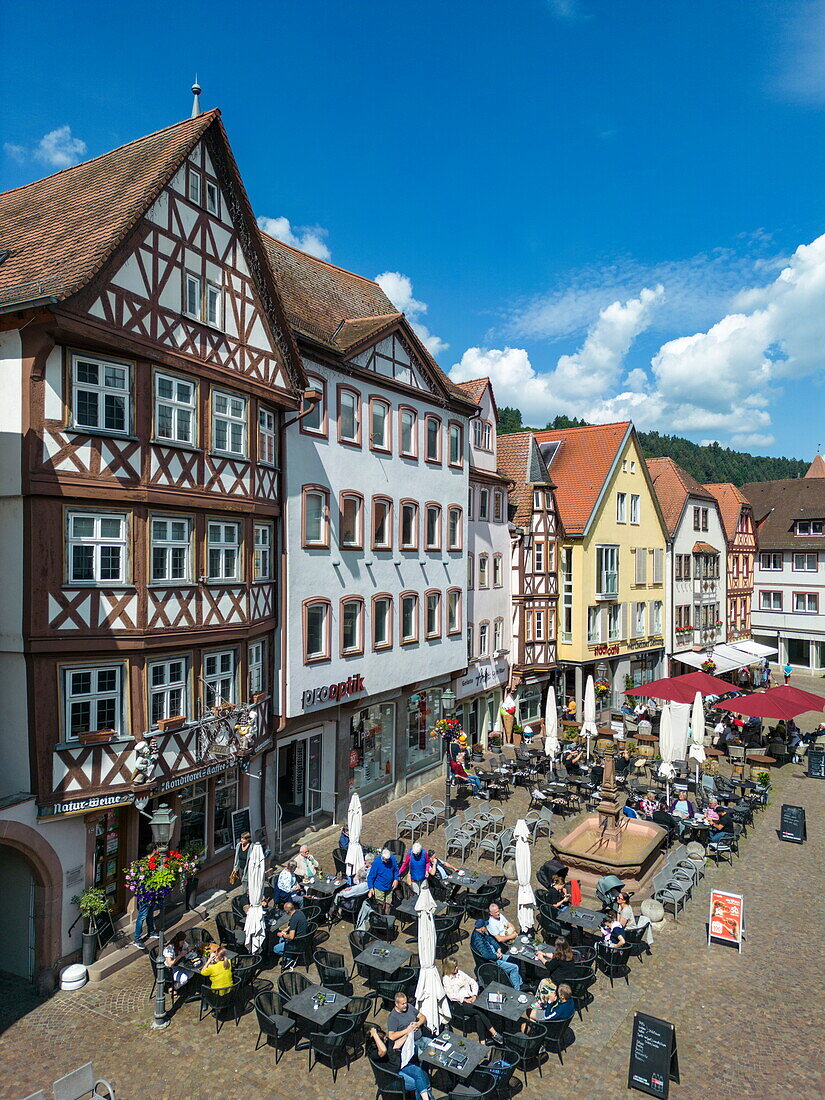  Aerial view of people at street cafes in the pedestrian zone of the old town, Wertheim, Spessart-Mainland, Franconia, Baden-Württemberg, Germany, Europe 