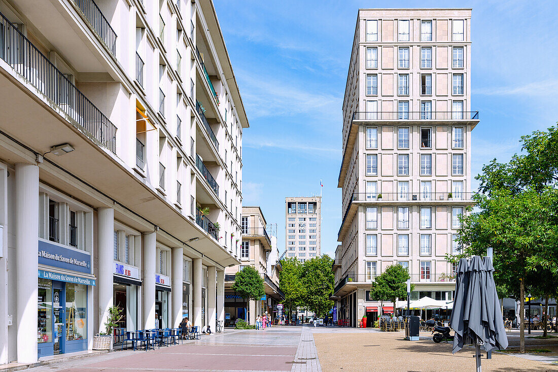  Rue de Paris with a view of the tower of the town hall l&#39;Hôtel de Ville and houses by Auguste Perret in Le Havre on the Alabaster Coast (Côte d&#39;Albatre, Cote d&#39;Albatre) in the Seine-Maritime department in the Normandy region of France 