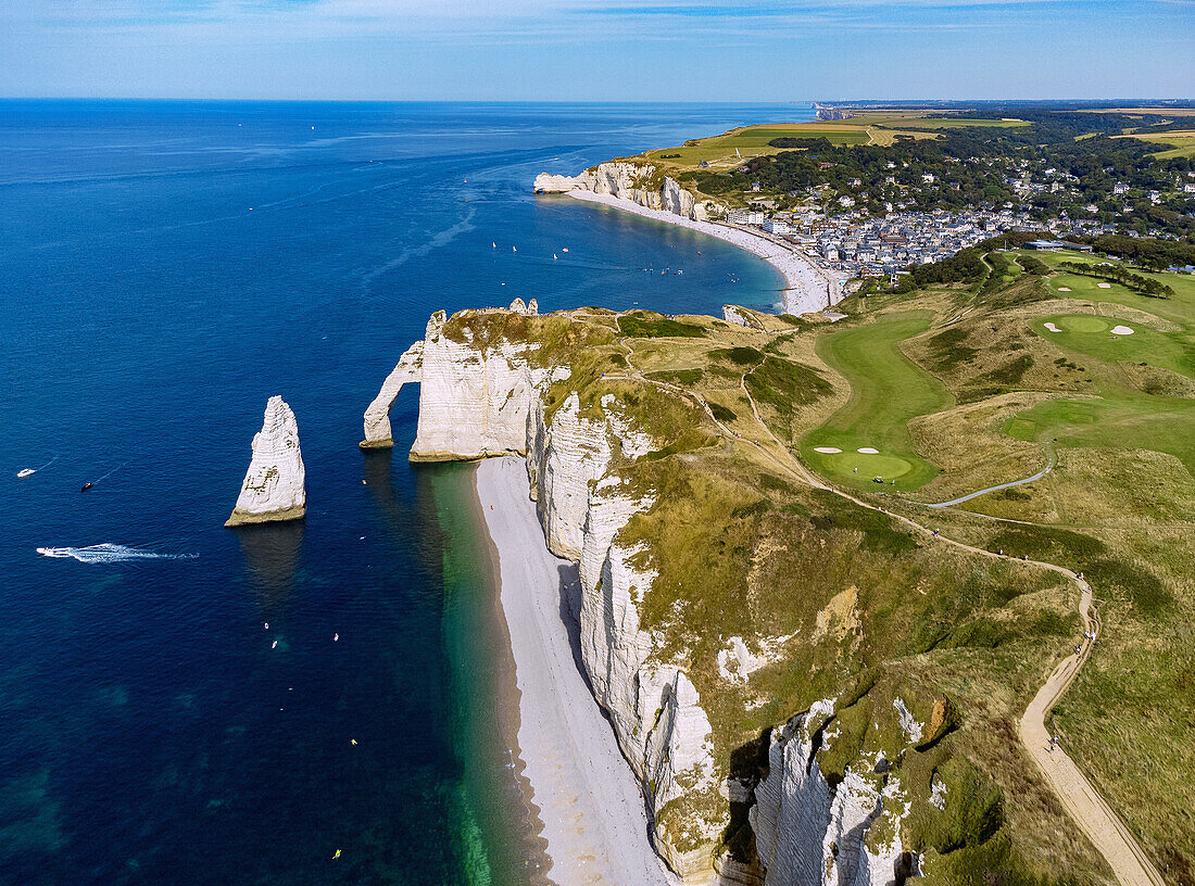  Rock needle l&#39;Aiguille, rock gate La Porte d&#39;Aval, hiking trail to rock gate La Manneport, golf course and view of Etretat (Étretat) and rock gate La Falasie d&#39;Aumont at high tide from the air on the Alabaster Coast (Côte d&#39;Albâtre, Cote d&#39;Albatre) in the Seine-Maritime department in the Normandy region of France 