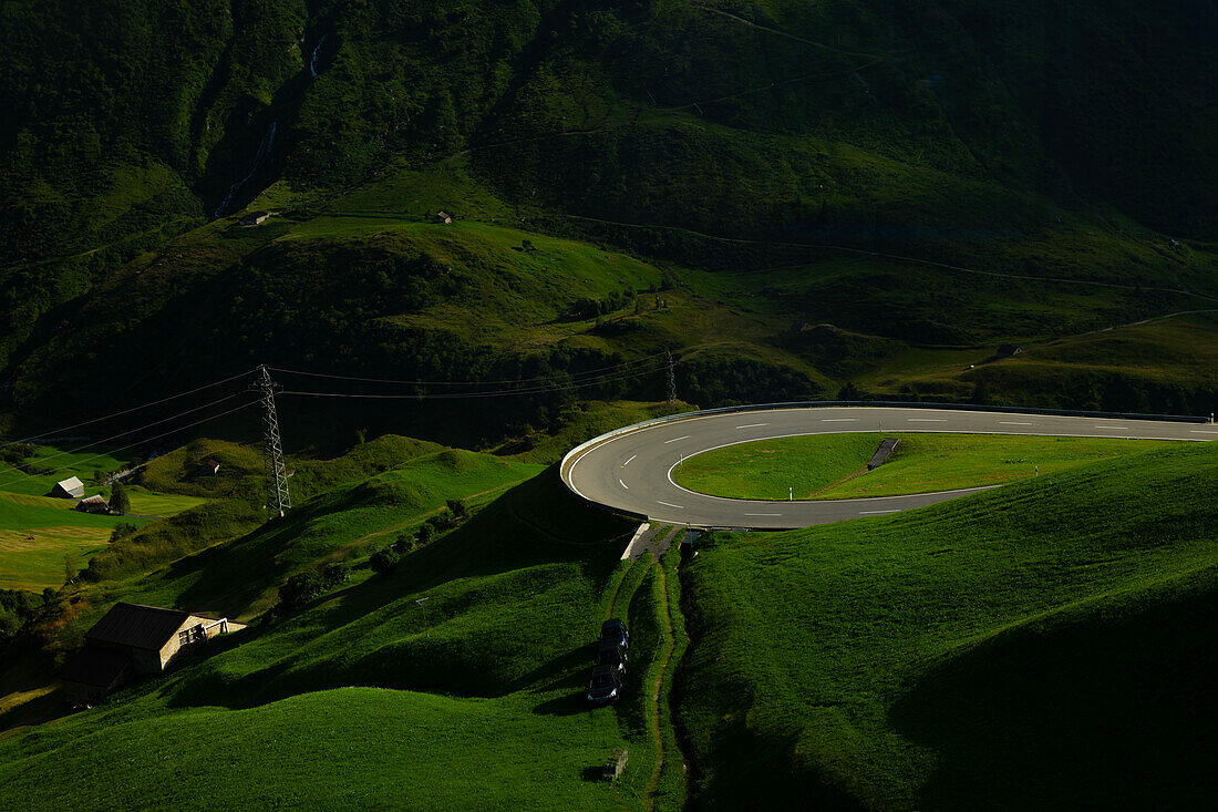 Mountain Road with View over a Mountain Valley in a Sunny Summer Day in Andermatt, Uri, Switzerland.