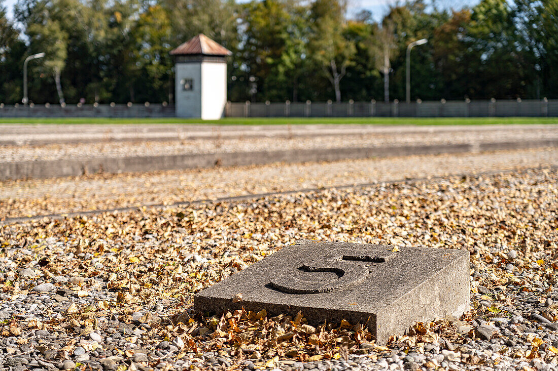  Foundations of the prisoner barracks and watchtower, Dachau Concentration Camp Memorial, Bavaria, Germany  