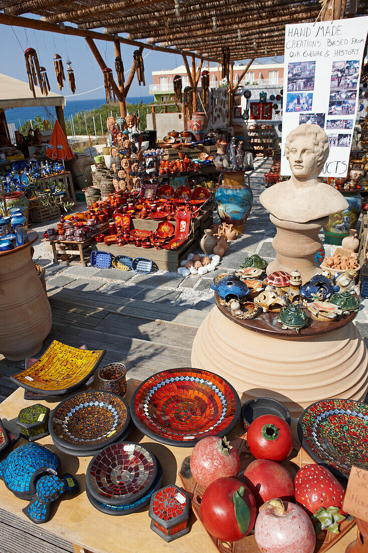 A selection of various handmade ceramic items displayed for sale at an outdoor market. Crete, Greece.