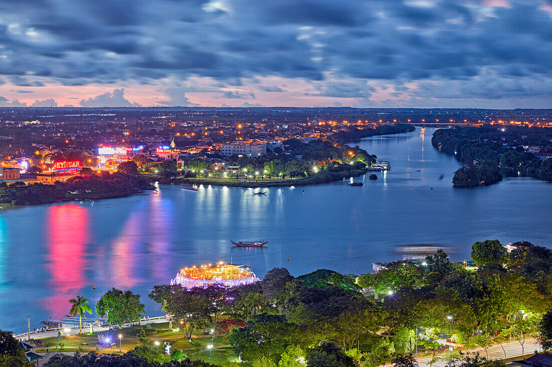 Low aerial view of the Perfume River and Hue city at dusk. Hue, Vietnam.