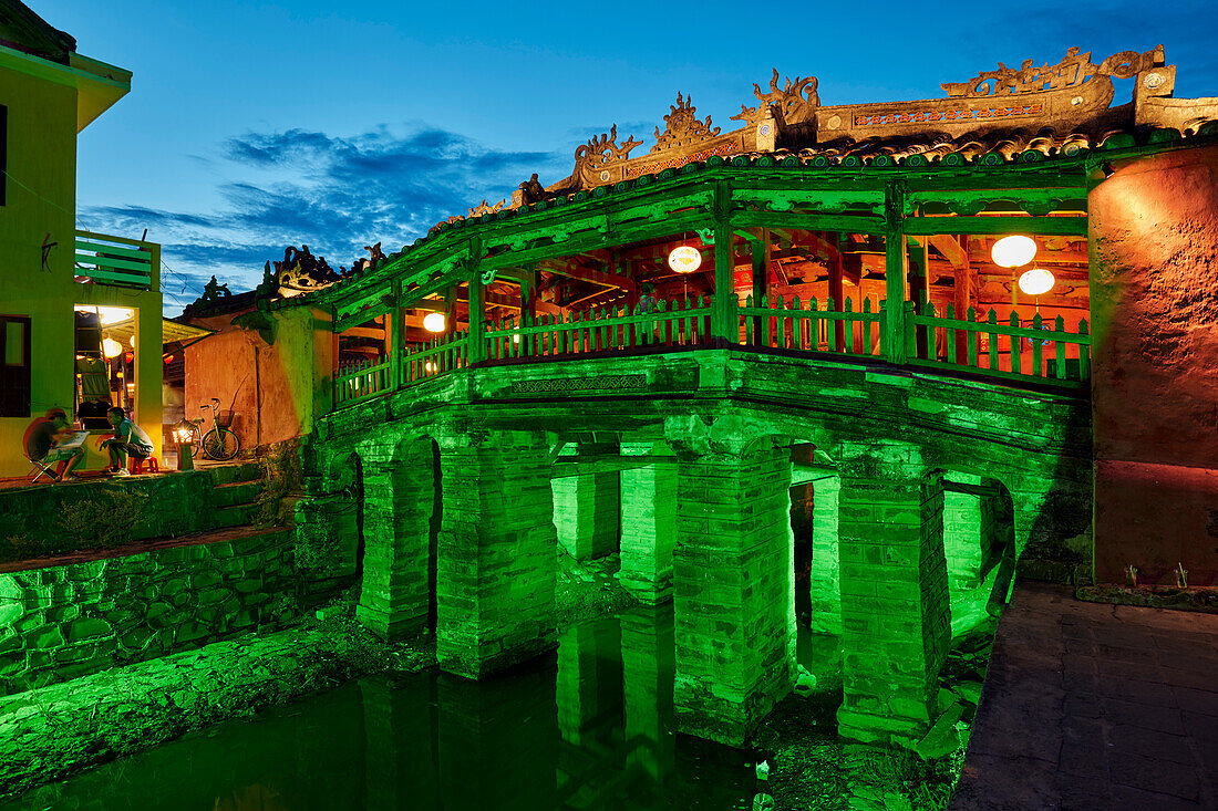 Exterior view of the Japanese Covered Bridge illuminated at dusk. Hoi An Ancient Town, Quang Nam Province, Vietnam.