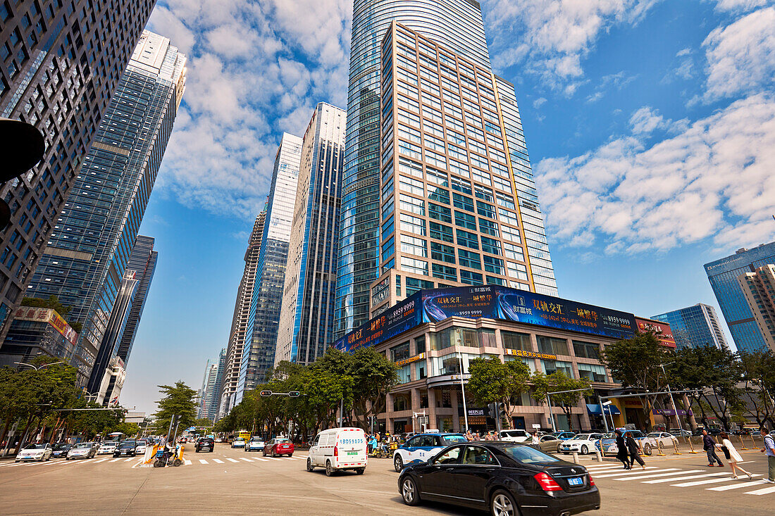 View of the street traffic and high-rise modern buildings in the Futian Central Business District (CBD). Shenzhen, Guangdong Province, China.