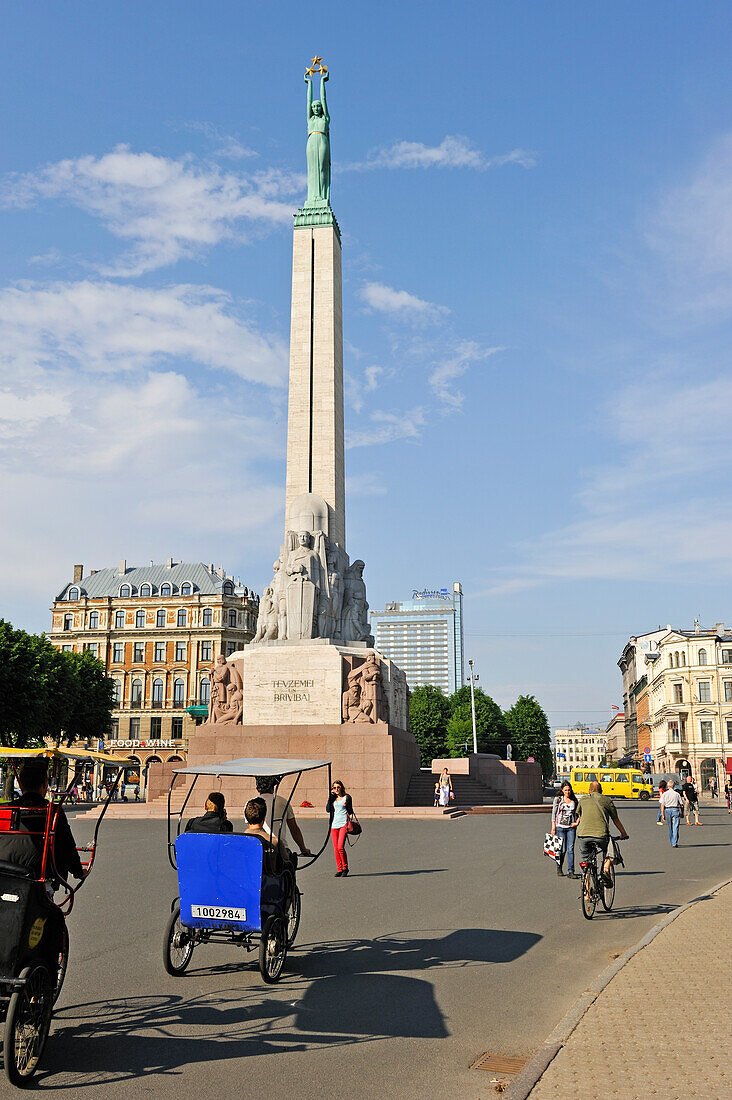 pedicab in front of the Freedom Monument, Brividas avenue,Riga,Latvia,Baltic region,Northern Europe