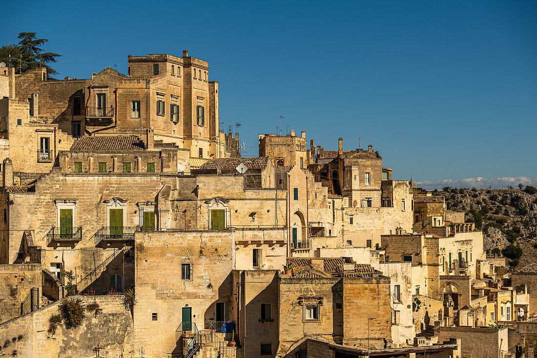 Stunning view on the houses of the Sassi di Matera, the historic center of Matera, Basilicata, Italy. The streets in some of the parts of the Sassi often run on top of other houses.