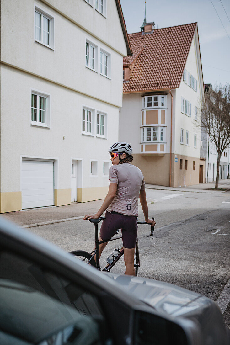 Road biking, woman riding a racing bike on the road