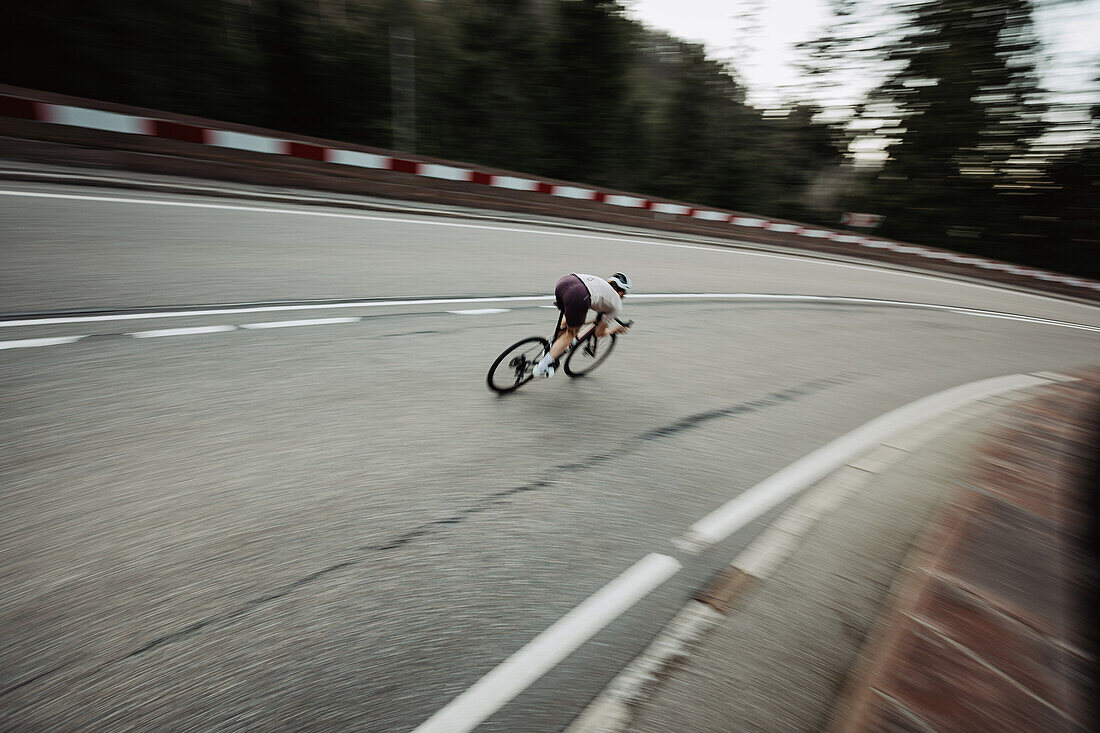 Road biking, woman riding a racing bike on the road