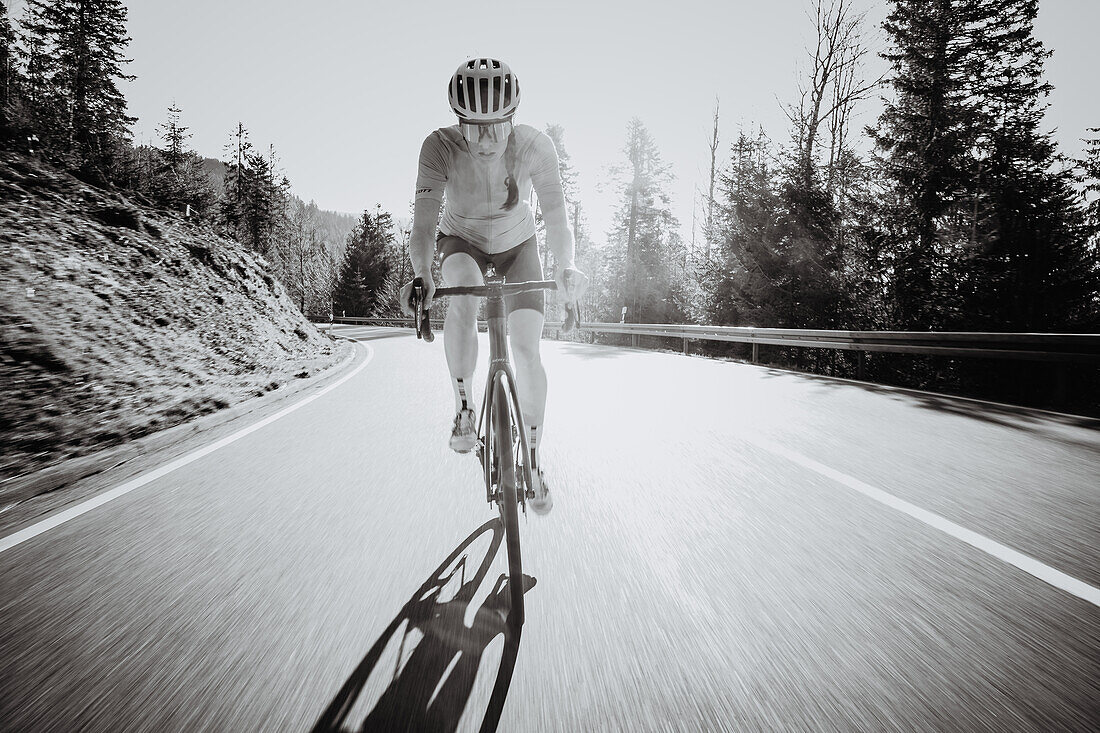 Road biking, woman riding a racing bike on the road