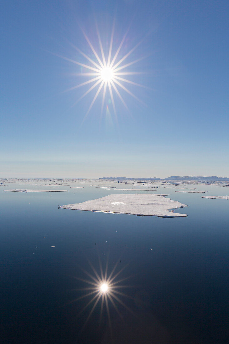  Midnight sun in the Arctic Ocean, Nordaustland, Spitsbergen, Norway 