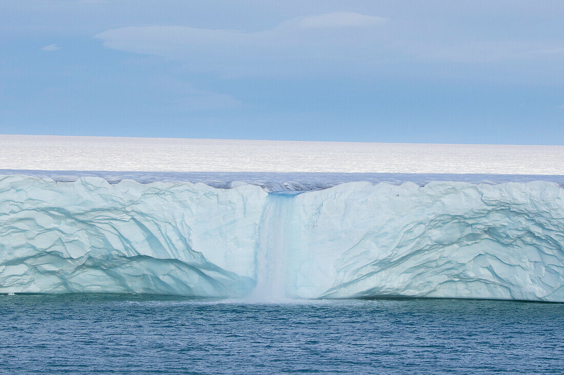  Waterfall at the Brasvellbreen glacier on the Austfonna ice cap, Svalbard, Norway 